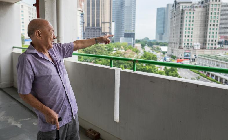 Reminiscing about the views from his corridor at his old Rochor Centre. When he first moved in, he had an unobstructed sea view. 