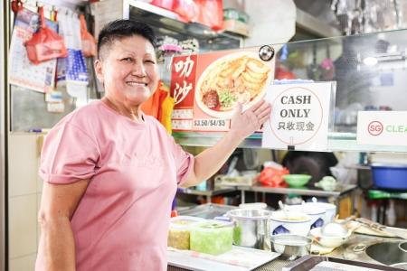 Some hawkers still insist on 'cash only' payment at their stalls