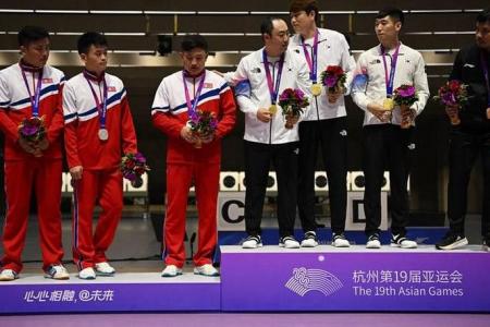 North Korean shooters snub South Koreans on Asian Games podium