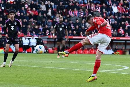 Bayern thump Union Berlin as Mueller marks milestone with double