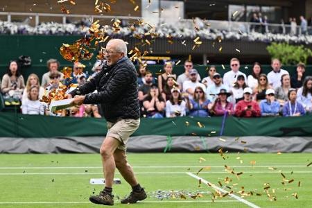 Wimbledon disrupted by climate change protesters; play halted as fans booed and jeered