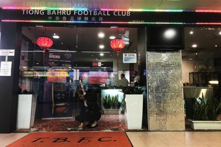 A member of staff of Tiong Bahru FC&#039;s clubhouse locking the premises some 30 mins after four individuals entered the club