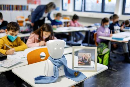 Boy, 7, attends class, interacts with others using avatar robot