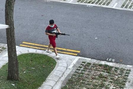 Is that a guy with a gun walking around in a Yishun carpark?