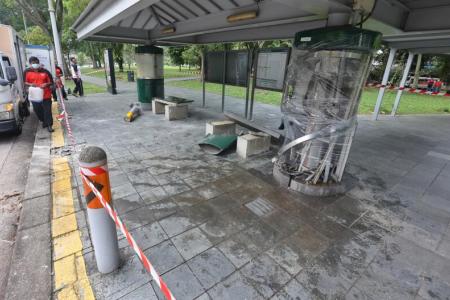 Car crashes into bus stop, driver missing when police arrive