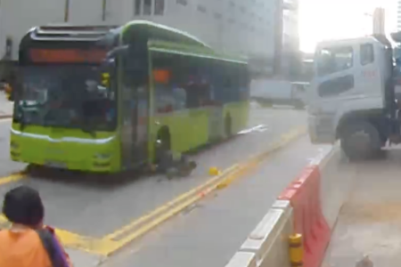 Bus at Anson Road drives over construction worker