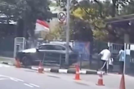 Car reverses into school's railing, narrowly misses girl