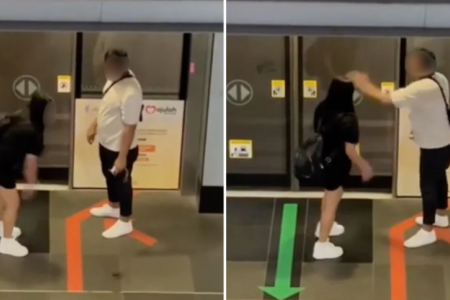 Crowd watches as man slaps woman at MRT station