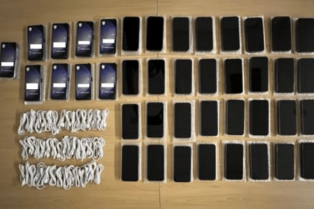 Four men charged over alleged sale of fake iPhones at discounted prices