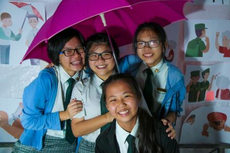  Evergreen Secondary School students Maybel Wong, Maybelle Ong, Yolanda Low and Pamela Lee of Team Passionfruit derived the idea of their Shields Of Singapore video from an umbrella.