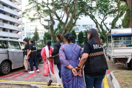 13 foreign maids, 14 errant employers arrested in MOM bust