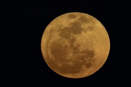 Singaporeans delighted to see supermoon on cloudy night