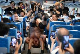 Japanese wrestlers Minoru Suzuki and Sanshiro Takagi skirmishing on a bullet train on Sept 18. 