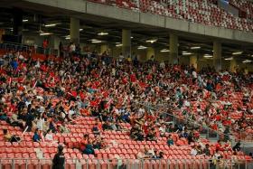 Spectators at the international football friendly match between Singapore and Solomon Islands at the National Stadium, 
 on June 18.