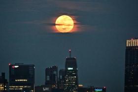 A supermoon occurs when the moon’s orbit is closest to Earth, making it appear larger and brighter.