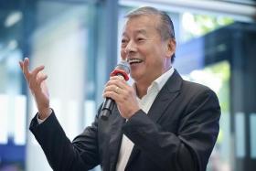 Mr George Goh speaking to young entrepreneurs at an event at SMU Connexion on July 10, 2023.