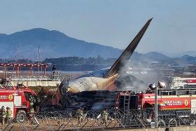 Firefighters extinguishing a fire on a Jeju Air aircraft which crashed at Muan International Airport in Jeju, South Korea on Dec 29.