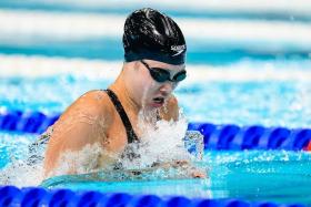 National swimmer Letitia Sim clocks 1min 07.75sec in the women&#039;s 100m breaststroke heats to place 25th out of 37 swimmers.