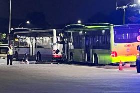 Photos of the incident’s aftermath show the front of a green bus wedged against the rear end of a white bus.