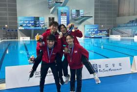 (Clockwise) National divers Max Lee, Alycia Lim, Clara Liaw and Ayden Ng posing with their medals at the Asian Diving Championships in Jiangmen, China.