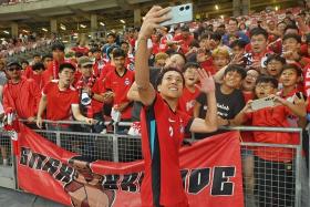 Singapore midfielder Kyoga Nakamura taking a wefie with  Lions supporters after their recent friendly 3-2 win over Myanmar on Nov 14.