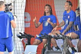 Netherlands' goalkeeper Andries Noppert "filming" teammates Nathan Ake and Virgil van Dijk during a training session on Dec 4.