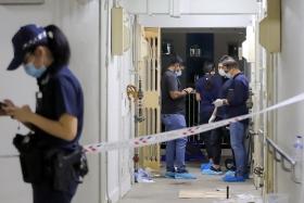 Police at the unit in Block 33 Bendemeer Road, where Ng Eng Kui was shot in the chest by police in March 2022.