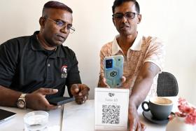 Mr Annadurai Periyasamy (right) said he was grateful to learn how to use a smartphone again after his release, from facilitators like Mr Murugason Mutthiah with Project ReConnect.