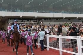 A crowd of 10,000 turned out for the last race meeting at the Singapore Turf Clb on Oct 5. 