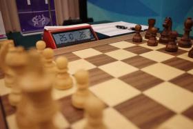 FILE PHOTO: Asian Games - Hangzhou 2022 - Chess - Hangzhou Qi-Yuan (Zhili) Chess Hall, Hangzhou, China - September 24, 2023 General view of chessboard during Women's Individual Round 1 REUTERS/Stanley Cheah/File Photo