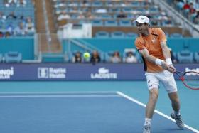 Mar 20, 2024; Miami Gardens, FL, USA; Andy Murray (GBR) hits a backhand against Matteo Berrettini (ITA) (not pictured) on day three of the Miami Open at Hard Rock Stadium. Mandatory Credit: Geoff Burke-USA TODAY Sports