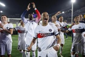 Soccer Football - Champions League - Quarter Final - Second Leg - FC Barcelona v Paris St Germain - Estadi Olimpic Lluis Companys, Barcelona, Spain - April 16, 2024 Paris St Germain&#039;s Kylian Mbappe with teammates celebrate after the match REUTERS/Juan Medina