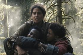 Halle Berry with (from left) Anthony B. Jenkins and Percy Daggs IV in Never Let Go.