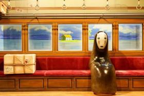 The exhibition will include 16 large-scale theatrical sets of iconic scenes such as the train carriage with the No-Face spirit from Spirited Away (2001). 