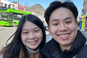 Singaporean Kayven Tan (pictured above with his partner) was shocked on his first day in South Korea when he heard the surprise announcement declaring martial law there.