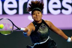 Naomi Osaka hitting a return against  Caroline Garcia during the Qatar WTA Open at Khalifa International Tennis and Squash Complex in Doha.