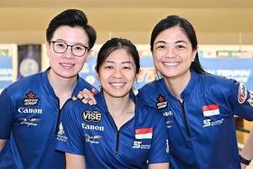 Singapore bowlers (from left) New Hui Fen, Bernice Lim and Daphne Tan come from behind to beat Malaysia to the women's trios gold.