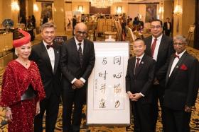 President Tharman Shanmugaratnam (third from left) with SRC 75th Anniversary Benefit Gala committee chairwoman Genevieve Peggy Jeffs, SRC chairman Tan Kai Hoe, Mr Fang Angzhen, Mr Pearce Cheng and SRC chief executive Benjamin William.