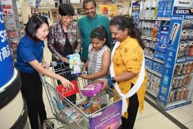 Five Sinda beneficiary families were also given $100 worth of FairPrice vouchers to shop at its supermarket in City Square Mall.