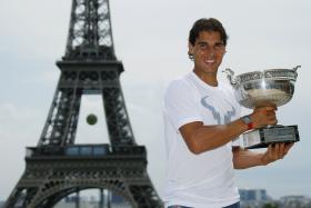 Nadal posing with the French Open title near the Eiffel Tower in Paris on Monday. 