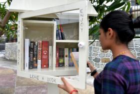 Some of the books in Mr Bryan Lim&#039;s mini library at 81 Woskel Road, with familiar books such as the Lord of The Rings books and books by Nicholas Sparks. 