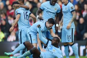 Manchester City players celebrate with Yaya Toure after his goal against Southampton.