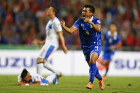 Kroekrit Thawikan celebrates after scoring for Thailand during their Suzuki Cup semi-final against the Philippines.