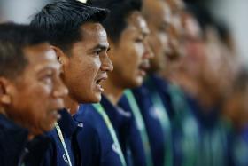 Thailand coach Kiatisuk Senamuang sings the Thai national anthem ahead of their Suzuki Cup semi-final clash with the Philippines.