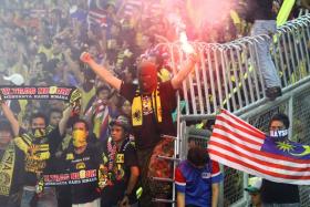 Malaysian fans at the Bukit Jalil Stadium in 2011.