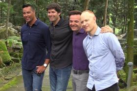 The Piano Guys stop for a picture at the Singapore Botanic Gardens. (From left to right: Al van der Beek, Paul Anderson, Steve Sharp Nelson and John Schmidt.)