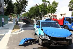 THIS MONTH: An overturned Volkswagen sport utility vehicle along St Patrick’s Road on Wednesday morning. The SUV had collided with a taxi at a nearby junction.