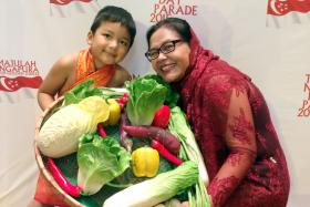 FINALLY: Madam Fattimah Shekh Adip Ally and her son, Aydan Ally, who is the youngest performer at this year&#039;s parade. 
