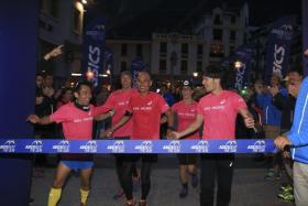 Team Asia Pacific crossing the finish line together. (First row from left) Mr Andy Neo, Mr Winston Ng, Mr Shingo Shintani. (Second row from left) Mr Pete Jacobs and Mrs Jamielle Jacobs. Mr Kota Araki is at the back in the blue jacket.