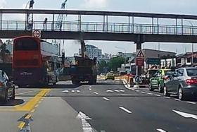 CRASH: (Above) The arm of the excavator hit the bridge, causing a chunk of it to break off.